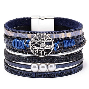 Detail of blue multilayer leather bracelet with tree of life charm and magnetic clasp