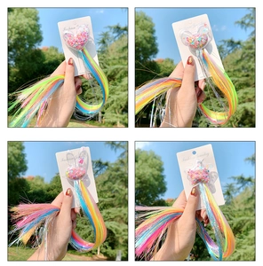 Detail view of colorful braided hair clips with glitter sequins for kids on card