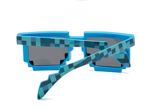 45-degree side view of blue pixelated square sunglasses with dark tinted lenses