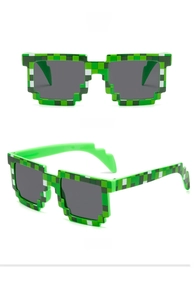 Green mosaic pixel sunglasses with gray lenses shown in front and 45-degree side views