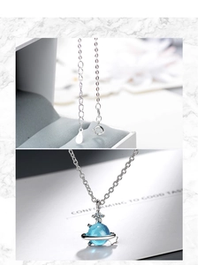 Detailed macro view of S925 silver blue planet pendant with lobster clasp and chain