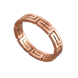 Polished rose gold titanium steel ring featuring a Greek meander镂空 design at 45 degree angle