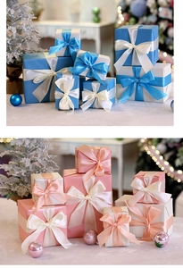 Close-up of premium Christmas gift boxes with silk ribbons in blue and pink pastel colors