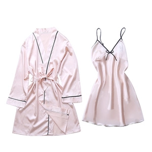 Detail of pink silk pajama set with elegant black piping and satin waist tie belt