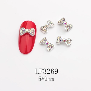 Gros plan de nœuds en alliage 5x9mm avec strass AB colorés pour décoration d'ongles
