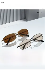 Close-up of vintage square metal frame sunglasses showing fine temples and lenses