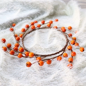 Orange autumn berry wreath centerpiece for Halloween and Thanksgiving table decor