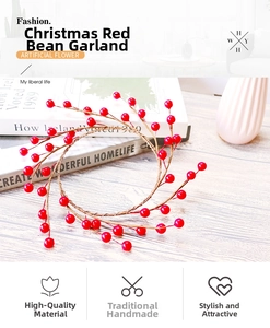Close-up of a Christmas wreath made of brown twigs and artificial red berries on a wooden desk