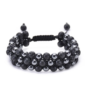 Macro view of triple-row braided lava stone and hematite beads with adjustable cord