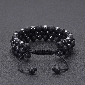 Triple-layer braided bracelet featuring natural lava stone and polished hematite beads