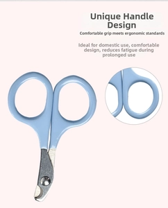 Detail of ergonomic light blue cat nail clipper with stainless steel curved blades