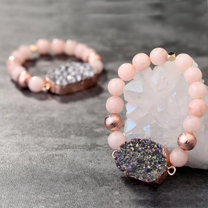 Natural pink quartz beaded bracelet featuring a shimmering druzy cluster pendant charm