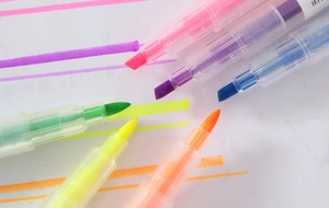 Close-up of 6-color candy highlighter pen set with chisel tips and vibrant ink strokes