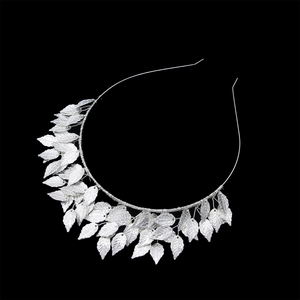 Elegant silver leaf headband featuring hand-wired metallic foliage on a black background