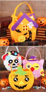 Variety of colorful DIY felt Halloween candy bags for kids with pumpkin and ghost designs.