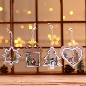 Set of four wooden laser-cut Christmas ornaments featuring reindeer and snowman patterns