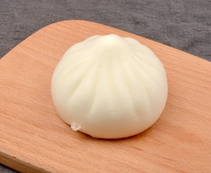 Detailed macro view of realistic 7cm steamed bun model with soft slow-rebound texture