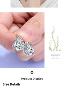 Detailed view of silver teardrop zircon earrings with halo diamond accent design