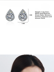 Detail showing tear-drop zircon stud earrings with 3.4g weight and 13mm size specifications