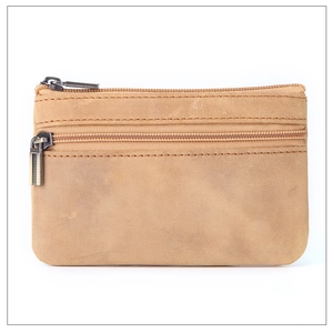 Close-up of brown crazy horse leather coin purse with durable double zipper detail