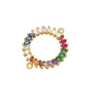 Macro detail of a golden rainbow micro-pave connector with multi-colored gemstones