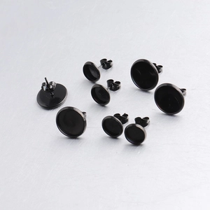 Detail view of black stainless steel round cabochon earring settings in multiple sizes