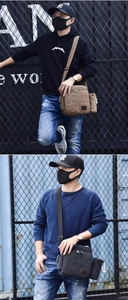 Detail view of canvas crossbody bag with multiple compartments and side water bottle pocket