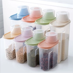 Detailed view of clear food containers with colorful lids and ergonomic handles