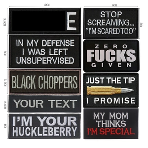 Detailed view of tactical embroidered patches with various slogans and size measurements