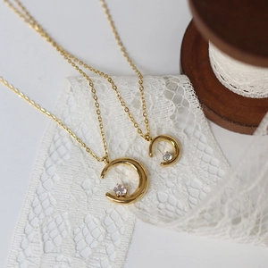 Minimalist 18K gold plated crescent moon pendant necklace set with sparkling zircon gems