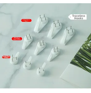 Detailed view of various invisible nail hooks in different sizes for wall mounting