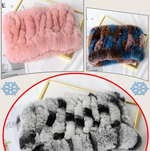 Detailed knit texture of thick rabbit fur scarf in pink, blue, and black grey tones
