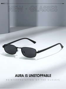 Detail of vintage square sunglasses with classic striped accents on the slim black temples