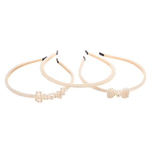 Three-piece bridal headband set with elegant pearls and delicate bow detail for women