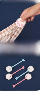 Close-up of cat paw quilt clips with anti-slip silicone design and safety needles