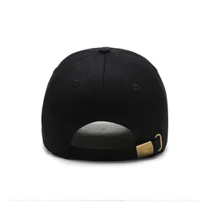 Detail of black cotton baseball cap showing adjustable vintage metal buckle at the back
