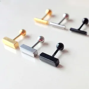 Minimalist bar stud earrings set in gold, silver, and black polished titanium steel