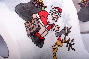 Detailed close-up of a novelty toilet paper roll with colorful Christmas character print