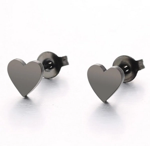 Detail of gunmetal heart stud earrings made of polished stainless steel with butterfly backs