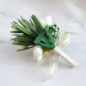 Detail showing the white artificial rose boutonniere with pin and green support frame