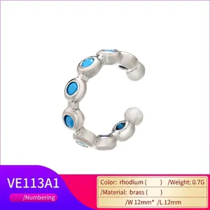 Macro view of C-shaped rhodium ear cuff with blue zircon, size 12mm by 12mm