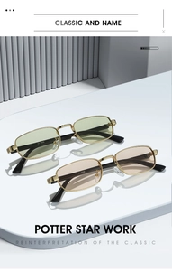 Detail of square gold metal frame sunglasses with yellow and brown tinted lenses