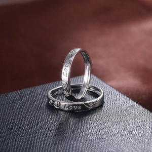 Romantic silver plated love couple rings with heart engraving and small crystal accents