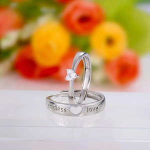Silver endless love couple rings set with heart gemstone and engraved text detail