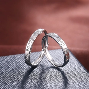 Silver plated open love rings for couples featuring small inlaid stones and adjustable band