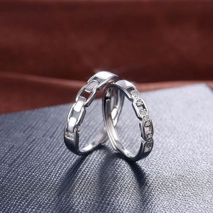 Silver chain-link couple rings with zircon accents and adjustable open design