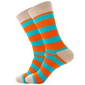 Close-up of orange and teal striped knitted crew socks with beige heel and toe accents