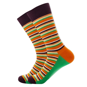 Detail of colorful striped crew socks with vibrant orange, green and purple knit texture