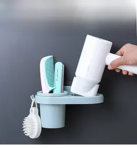 Wall-mounted hair dryer holder with storage cup and hooks for bathroom organization