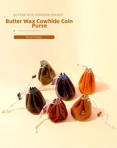 Group display of colorful oil wax cowhide drawstring coin purses in various vintage shades